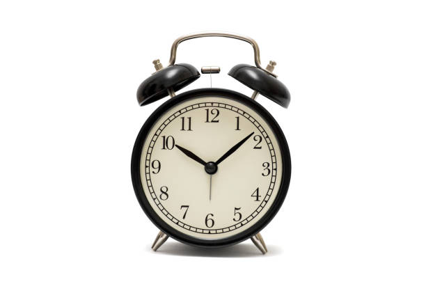 istock Classic black table clock isolated on a white background. Black retro alarm clock isolated on white background 1277004856
