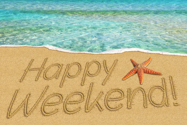 istock happy weekend sign on sand and starfish 1277006373