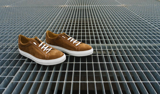 istock Brown men's shoes with metal background 1277006756