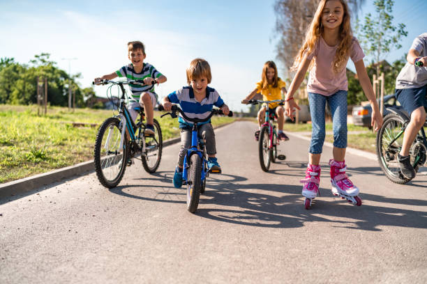 Boy riding bicycle with training wheels.  Blur motion.