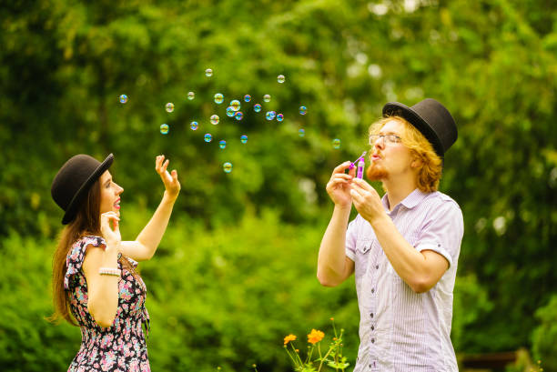 istock Couple blowing bubbles outdoor 1277010058