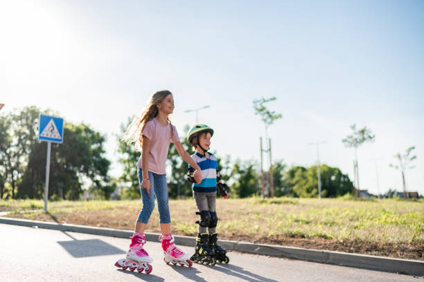 istock Children drive roller skates on the street 1277010115