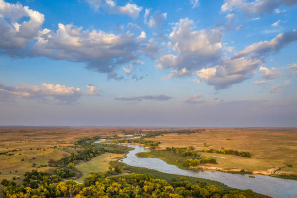 Dismal River flowing through Nebraska Sandhills shallow and wide Dismal River flowing through Nebraska Sandhills at Nebraska National Forest, aerial view of afternoon scenery in early fall nebraska stock pictures, royalty-free photos & images