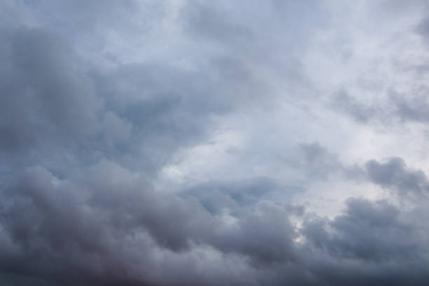 istock Grey high layered epic clouds on stormy sky 1277012845