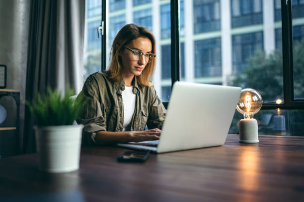 istock Young woman working with a laptop. Female freelancer connecting to internet via computer. Businesswoman at work 1277014409