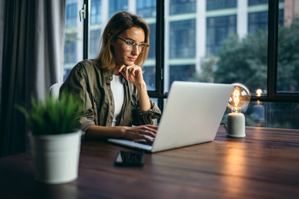 istock Young woman working with a laptop. Female freelancer connecting to internet via computer. Businesswoman at work 1277014410