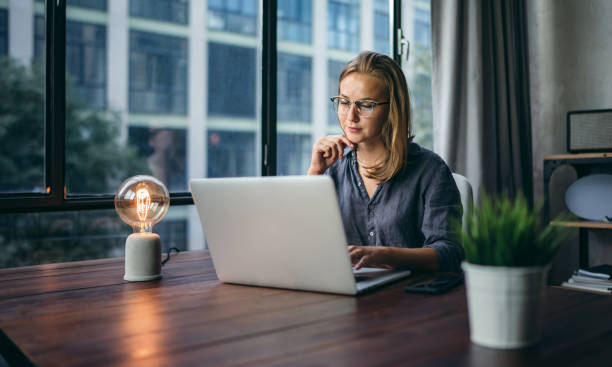 istock Young woman working with a laptop. Female freelancer connecting to internet via computer. Businesswoman at work 1277014416