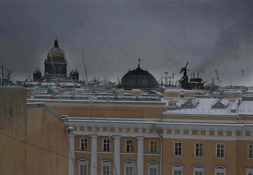 Sights of St. Petersburg through wet glass on a rainy gray day.