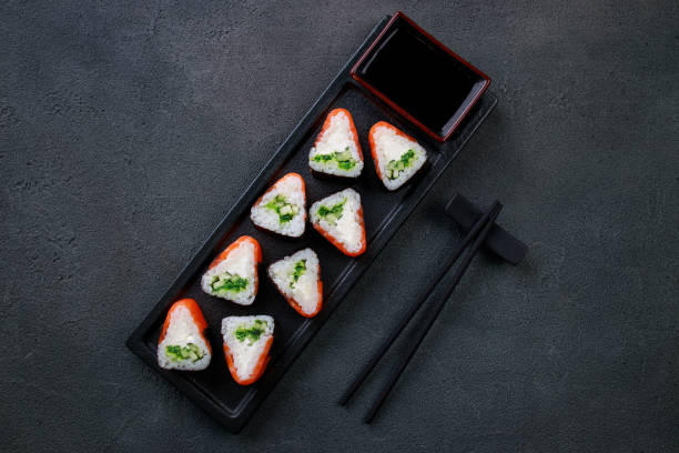 istock Seafood delicatessen salmon sushi rolls on plate 1277020154
