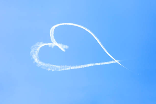 istock Heart in the sky, light blue background with copy space 1277021323