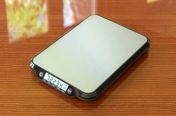 Digital Food Kitchen Scale on the wooden table, 3D rendering