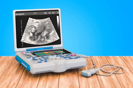 Portable medical ultrasound diagnostic machine on the wooden table, 3D rendering