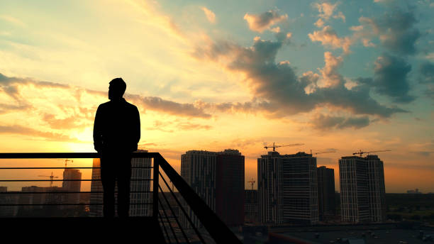 istock The man standing on the balcony on the building background 1277022507