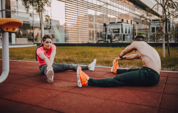 istock Fitness couple doing stretching exercise outdoors 1277032229