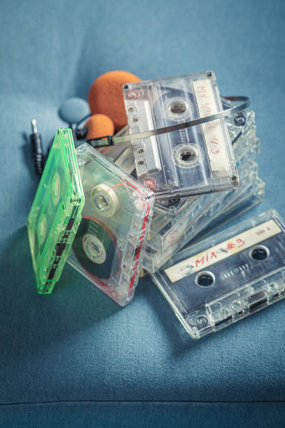 istock Antique stack of audio cassettes with orange headphones 1277036432