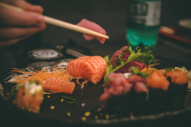 istock Sushi with chopsticks at Japanese Restaurant 1277038129