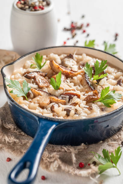 istock Rustic risotto made of wild mushrooms and herbs 1277038172