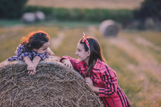 istock Charming sisters spending beautiful playful day at village 1277039281