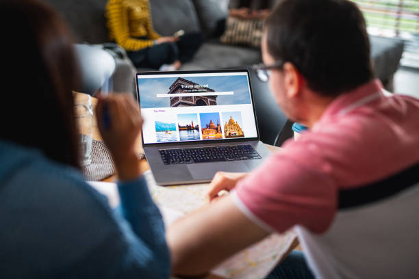 istock Heterosexual Couple Planning A Vacation Together Using Laptop 1277040237