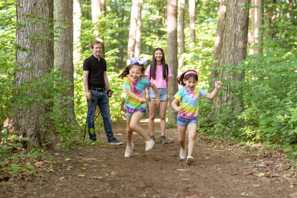 istock Multiethnic family hiking in a forest 1277041045