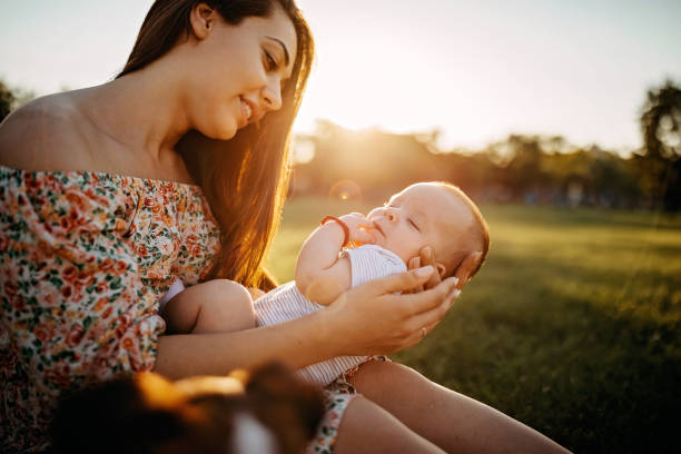 istock Mother holding baby 1277047323