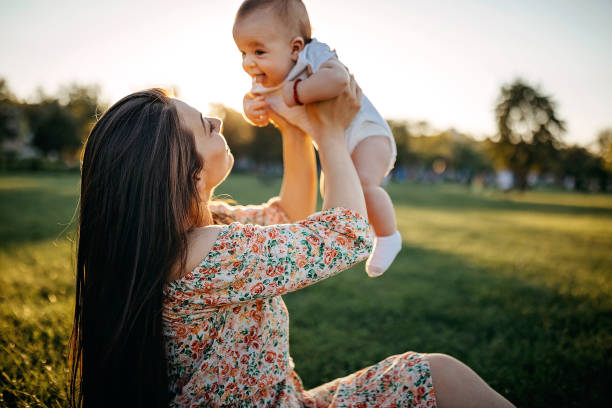 istock Mother holding baby 1277047356