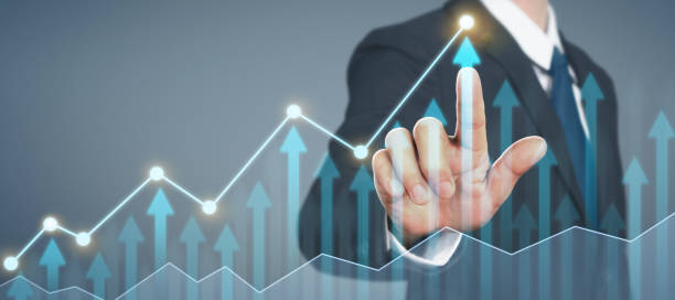 istock Businessman plan graph growth and increase of chart positive indicators in his business 1277052349