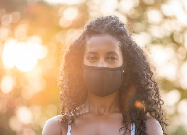 istock African American woman wearing protective face mask 1277055268