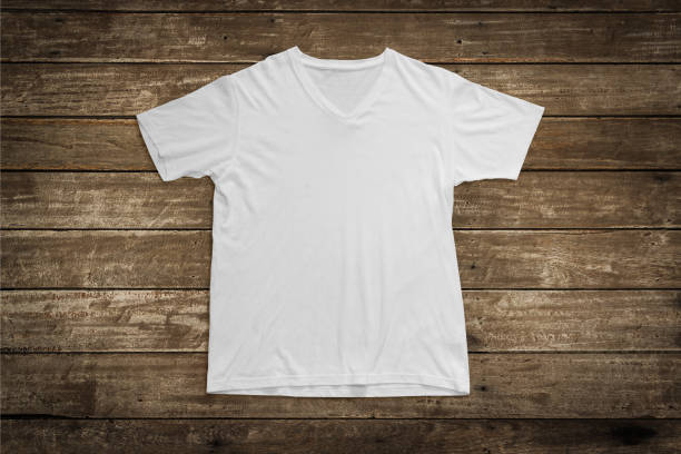 istock White t-shirt mockup on wood background template. 1277055917