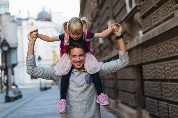 istock She loves sitting on dad's shoulders 1277056201