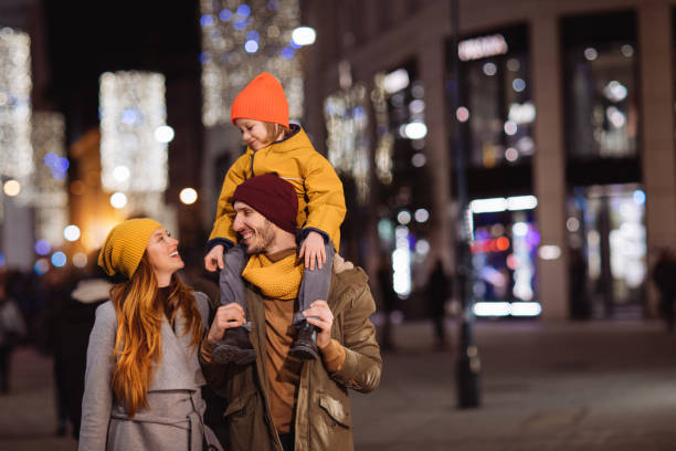 istock Parents looking at each other while father carrying a boy on his shoulders 1277057036