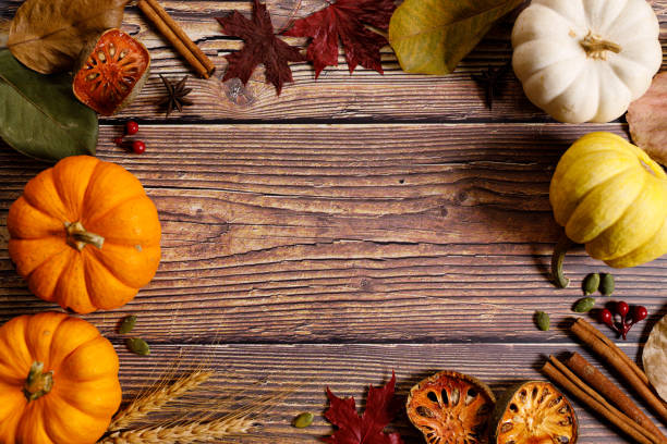 istock Autumn background with pumpkin and dried leaves 1277059443
