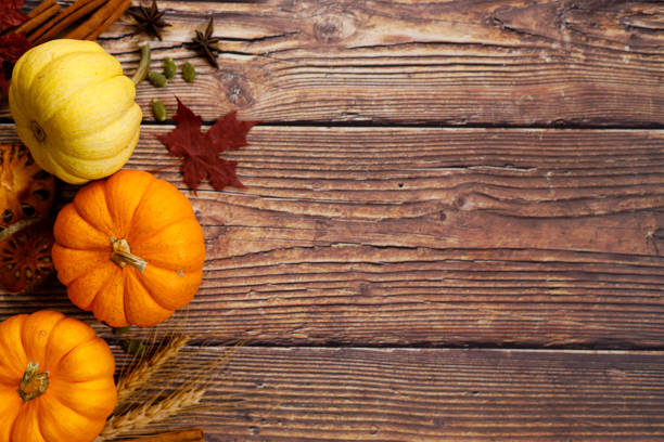 istock Autumn background with pumpkin and dried leaves 1277059457