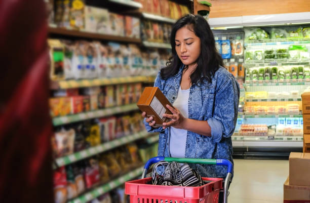 istock Southeast Asian woman reading nutrition label on cereal packaging 1277064407