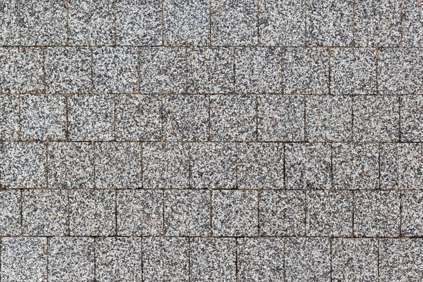 istock Overhead view of cobble stone street . Stone pavement texture 1277064552