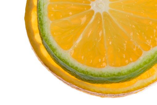 slice of fresh lemon and orange on white background