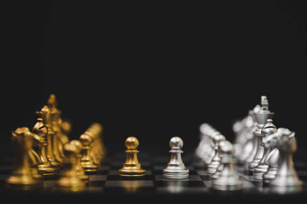 istock Business competition and strategy plan concept. Chess board game gold and silver colour 1277066467