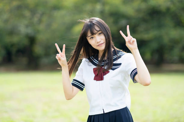 istock High school student posing with V sign 1277068383
