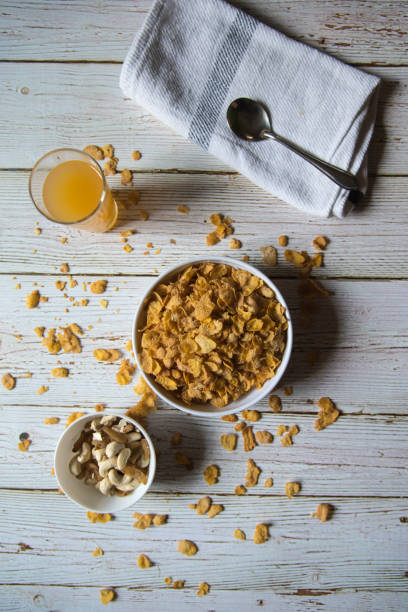 top view of dry fruits, corn flakes and fruit juice - oat whole wheat cereal plant oat flake imagens e fotografias de stock