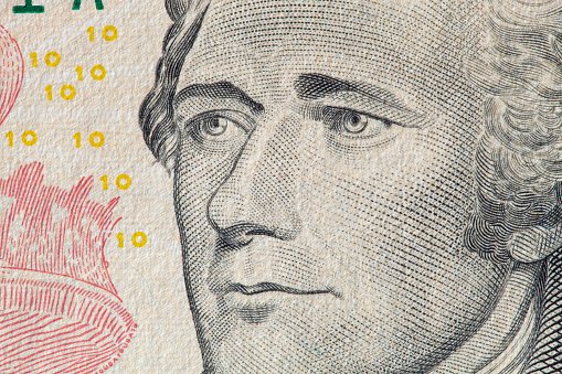 Alexander Hamilton portrait on 10 dollar bill. Close-up.