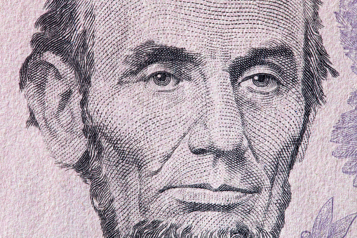 Abraham Lincoln portrait on 5 dollar bill. Close-up.