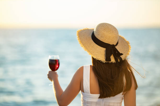istock woman drinking red wine on outdoors 1277074085