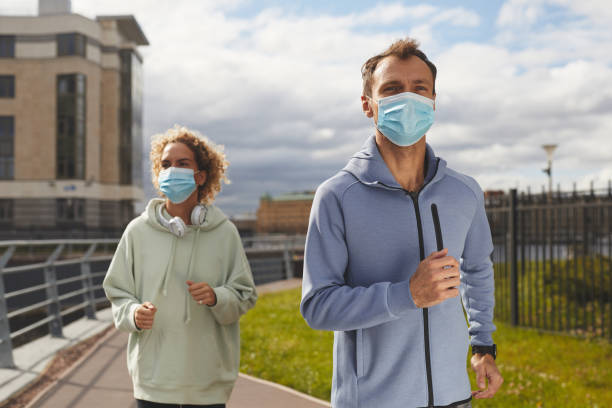 istock Couple jogging outdoors 1277080876