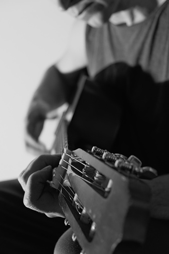Guitar player with classic guitars. Chord, instrument.Musician with a guitar. Hands and guitar strings close-up.Hobby and music concept.