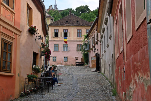 Sighisoara/Romania;  06/30/2018. A narrow cobbled street in the historic center of Sighisoara.