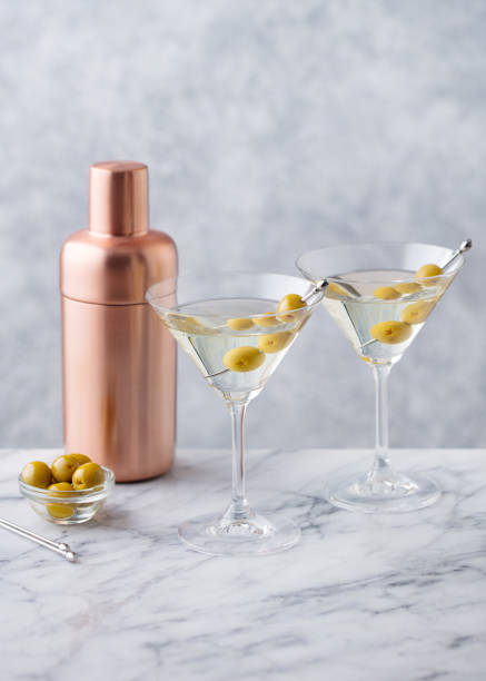 istock Martini cocktail with olives and bar shaker. Marble background. Copy space. 1277088780