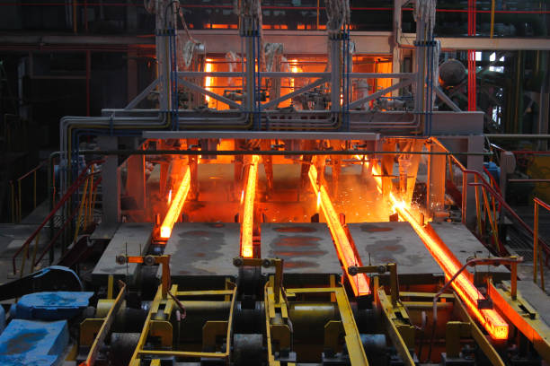 istock Red hot steel metal billets after molten steel casting.  Continuous casting machine. Background of the blacksmith and metallurgical industry. 1277089033