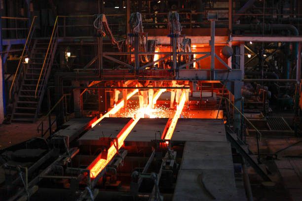 istock Red hot steel metal billets after molten steel casting.  Continuous casting machine. Background of the blacksmith and metallurgical industry. 1277089042