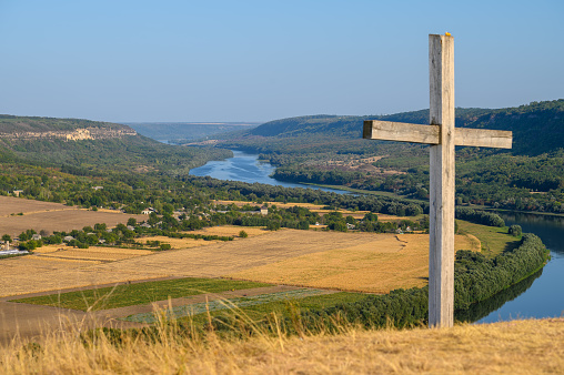 Cross at the top of hill and view to the Dniester river near Socola village, Soldanesti district, Moldova