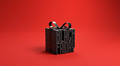 Black friday in gift box wrapped with black ribbon on red background, idea and creative, copy space.